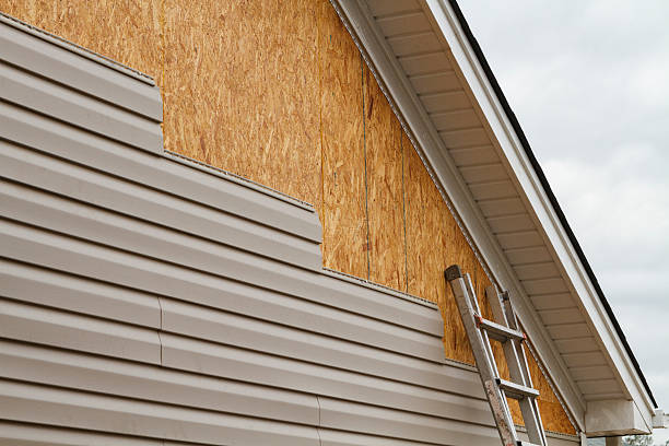 Professional Siding Contractor technician working in Wilmington, MA
